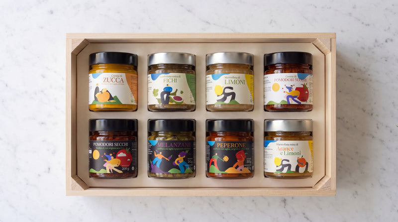 Acht ambachtelijke Italiaanse potjes in een houten kist als zakelijk kerstpakket